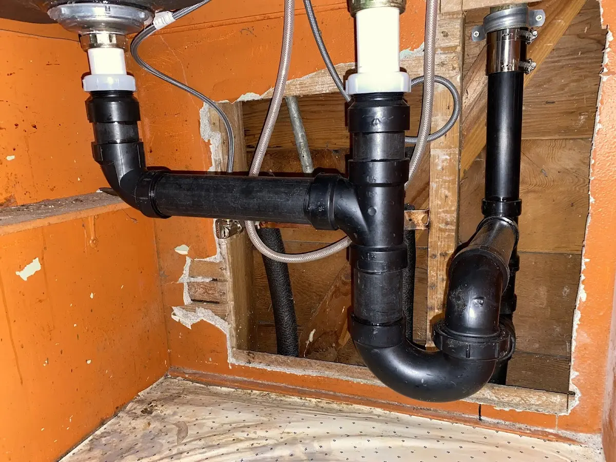Professional Garbage Disposal Repair equipment and tools on the job in West Burlington